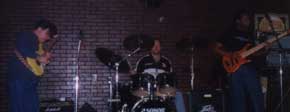 Lewis, Migel, and Bono on the drums